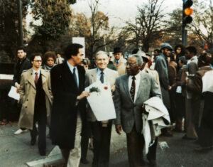 Rep. Don Edwards and Rep. George Crockett Jr. (D-MI) march in front of the South African embassy in Washington, D.C. as part of the Free South Africa protest movement