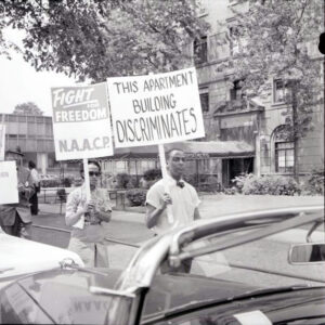 NAACP pickets apartment building for discriminative housing practices (1963)