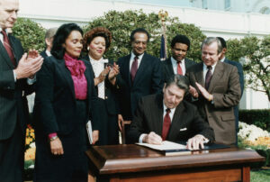 Ronald Reagan Signs The Martin Luther King Jr. Holiday Bill