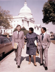 Rep. Barbara Jordan (D-TX) and Rep. Andrew Young (D-GA) walking with an unidentified man